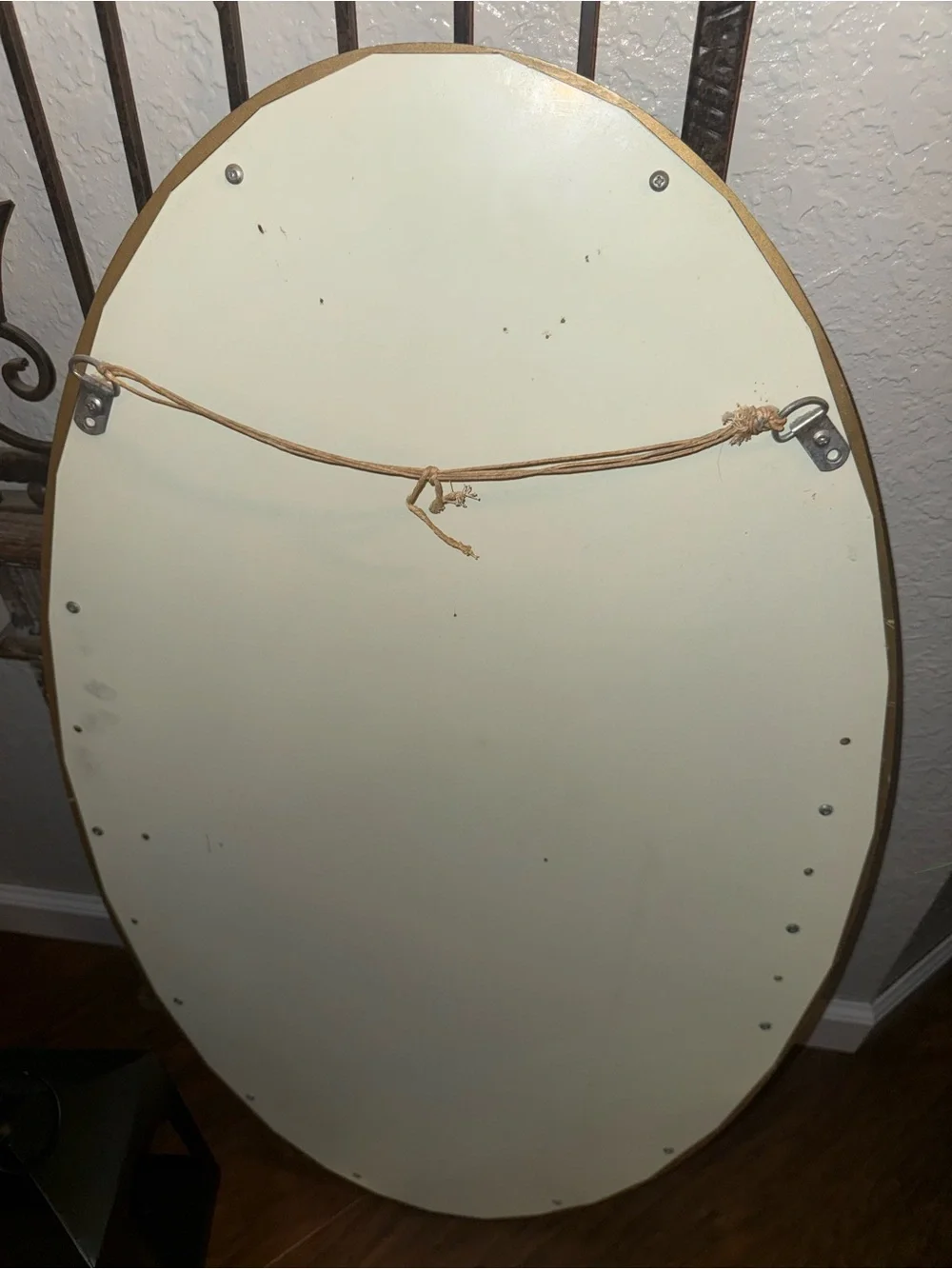 Vintage Oval Wall Mirror Featuring An Ornate, Off-White And Gold-Accented Frame